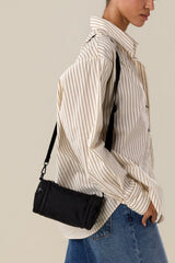 The Expandable Crossbody Charm in Black